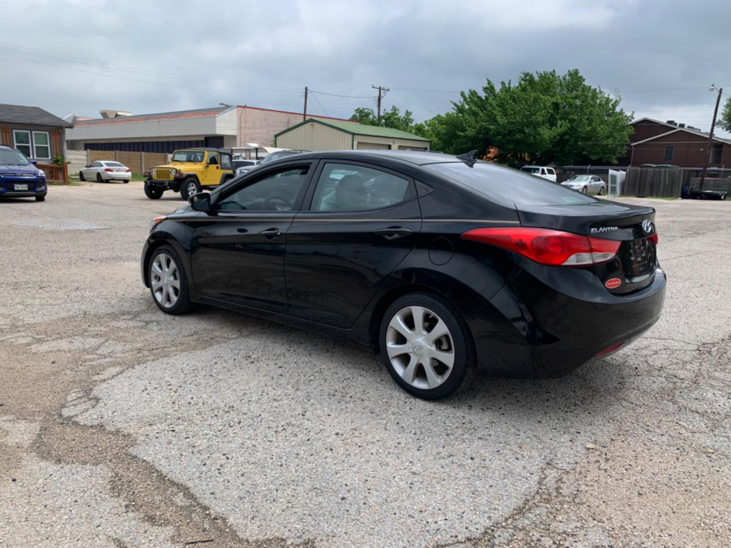 2012 Black Hyundai Elantra GLS A/T (KMHDH4AE3CU) with an 1.8L L4 DOHC 16V engine, Automatic transmission, located at 1830 North Belt Line Road, Irving, TX, 75061, (469) 524-0199, 32.834373, -96.993584 - Photo#5